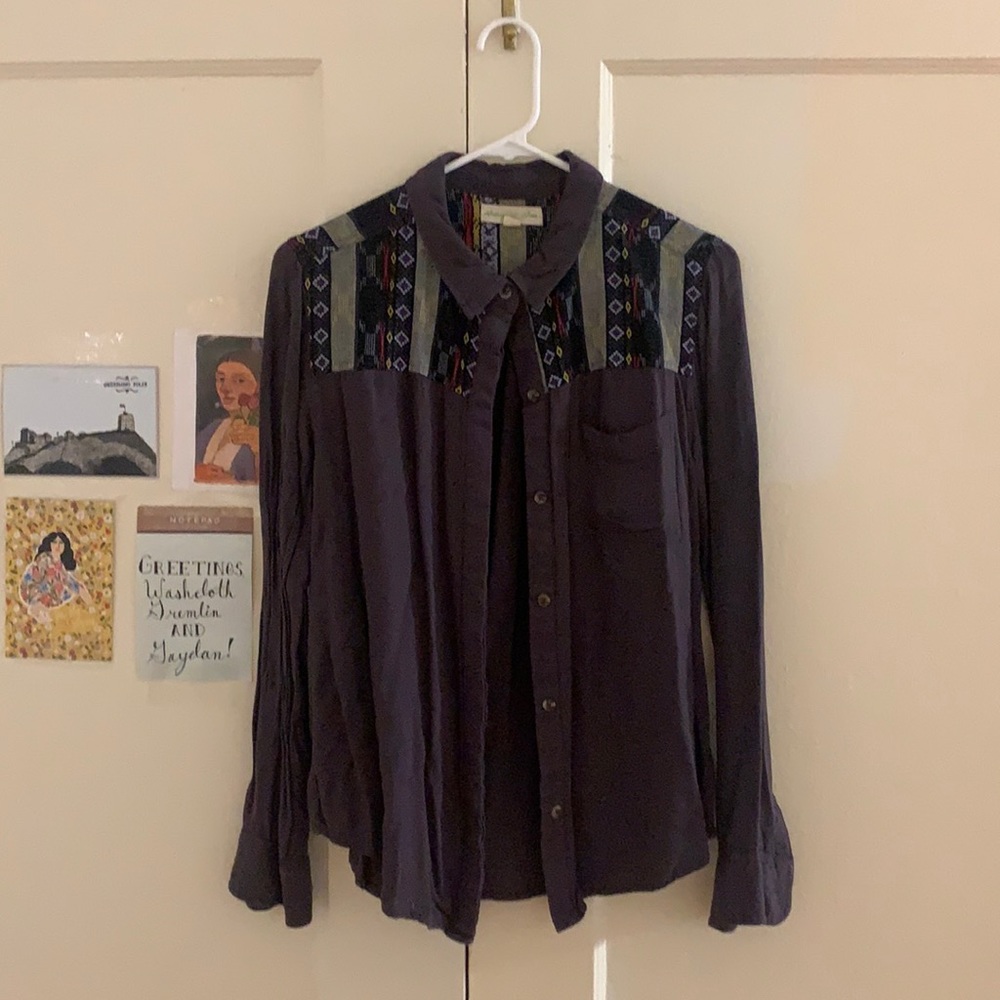 Purple collared shirt with shoulder design